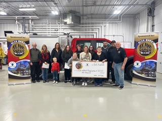 Community partners gather for a Bear Claw CDC funding presentation.